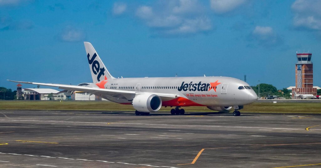 Passenger opens jet’s door and walks on wing after landing